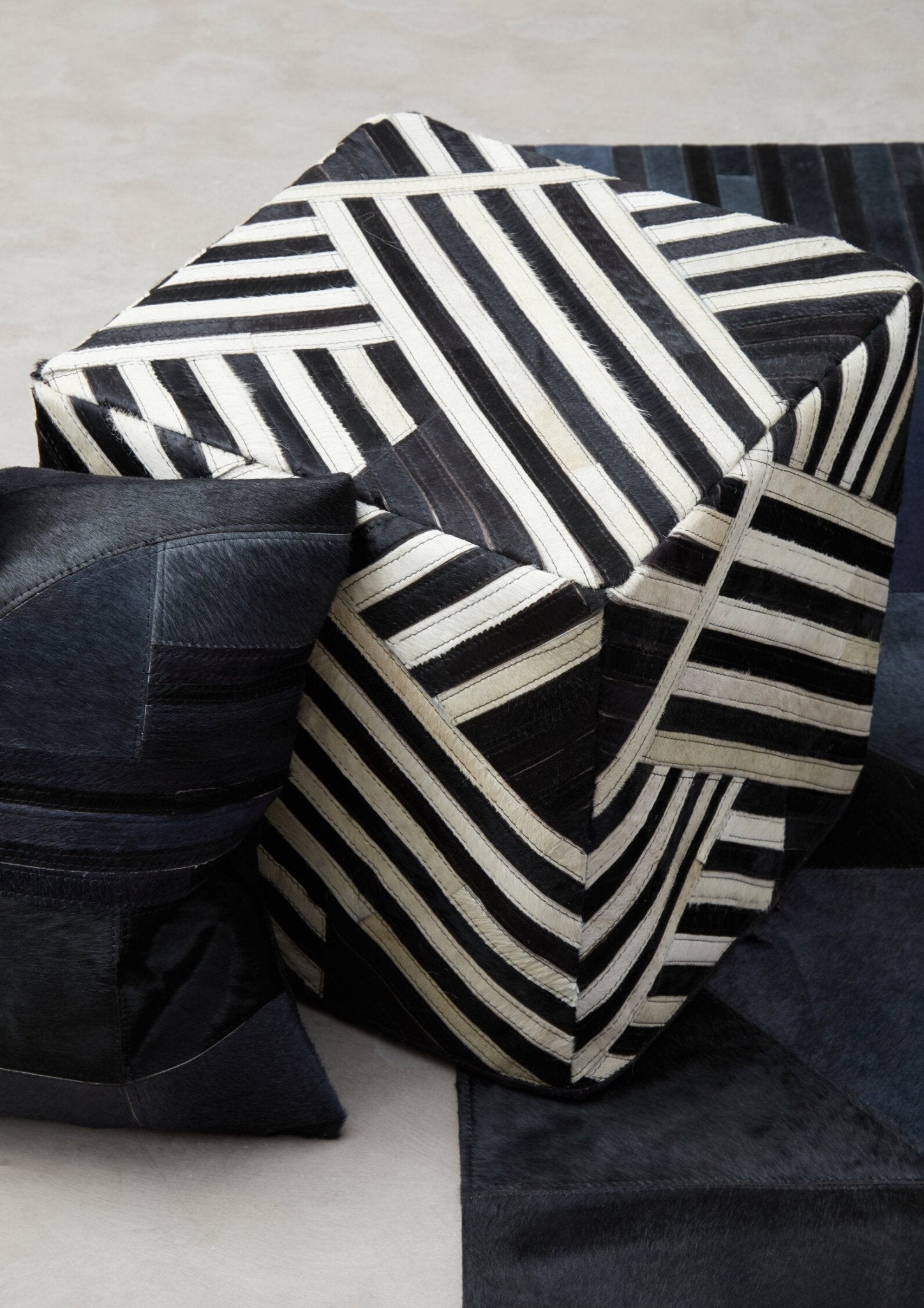 Bosie Safira Black And White Stripe Leather Pouffe | Luxury Home Accessories | Heulog Glow