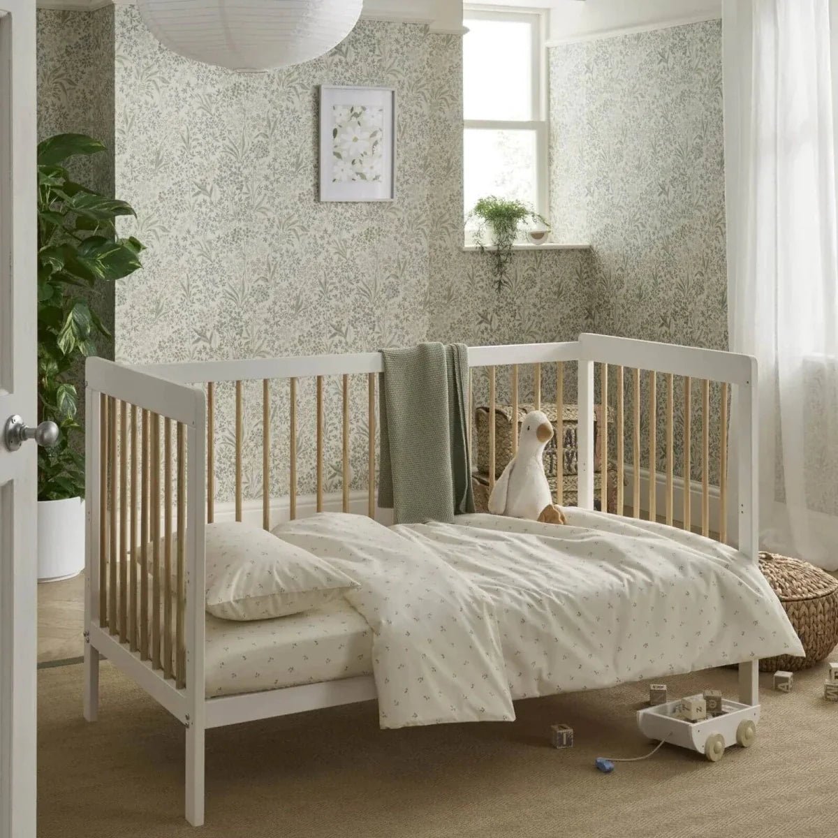 CuddleCo Nola Cot Bed - White/Natural | Luxury Home Accessories | Heulog Glow