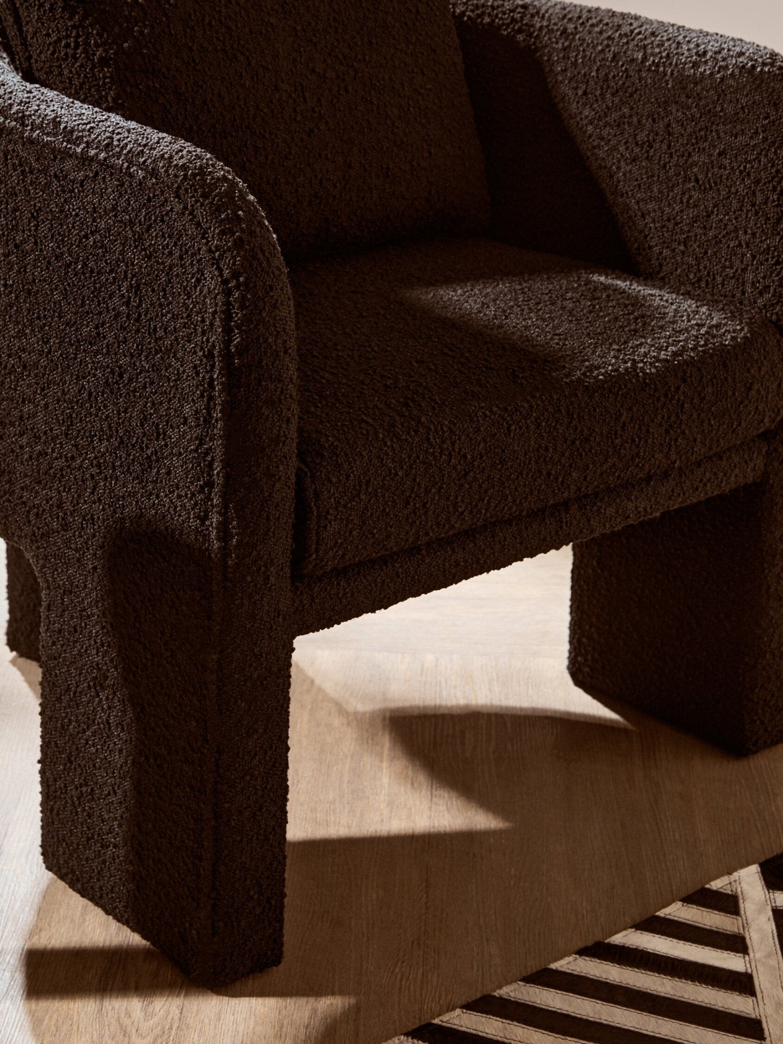 Ozzero Black Boucle Curved Armchair | Luxury Home Accessories | Heulog Glow