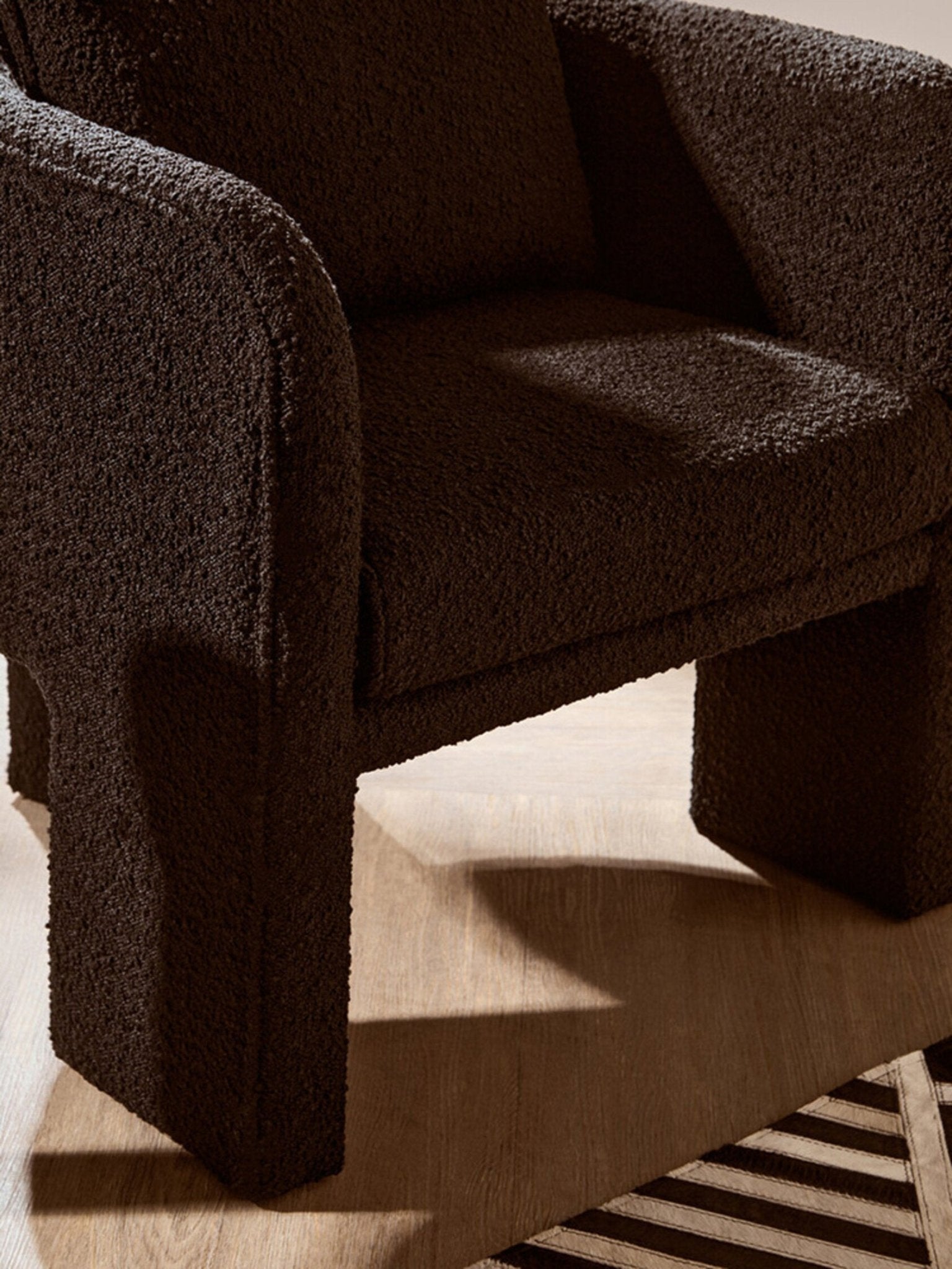 Ozzero Black Boucle Curved Armchair | Luxury Home Accessories | Heulog Glow