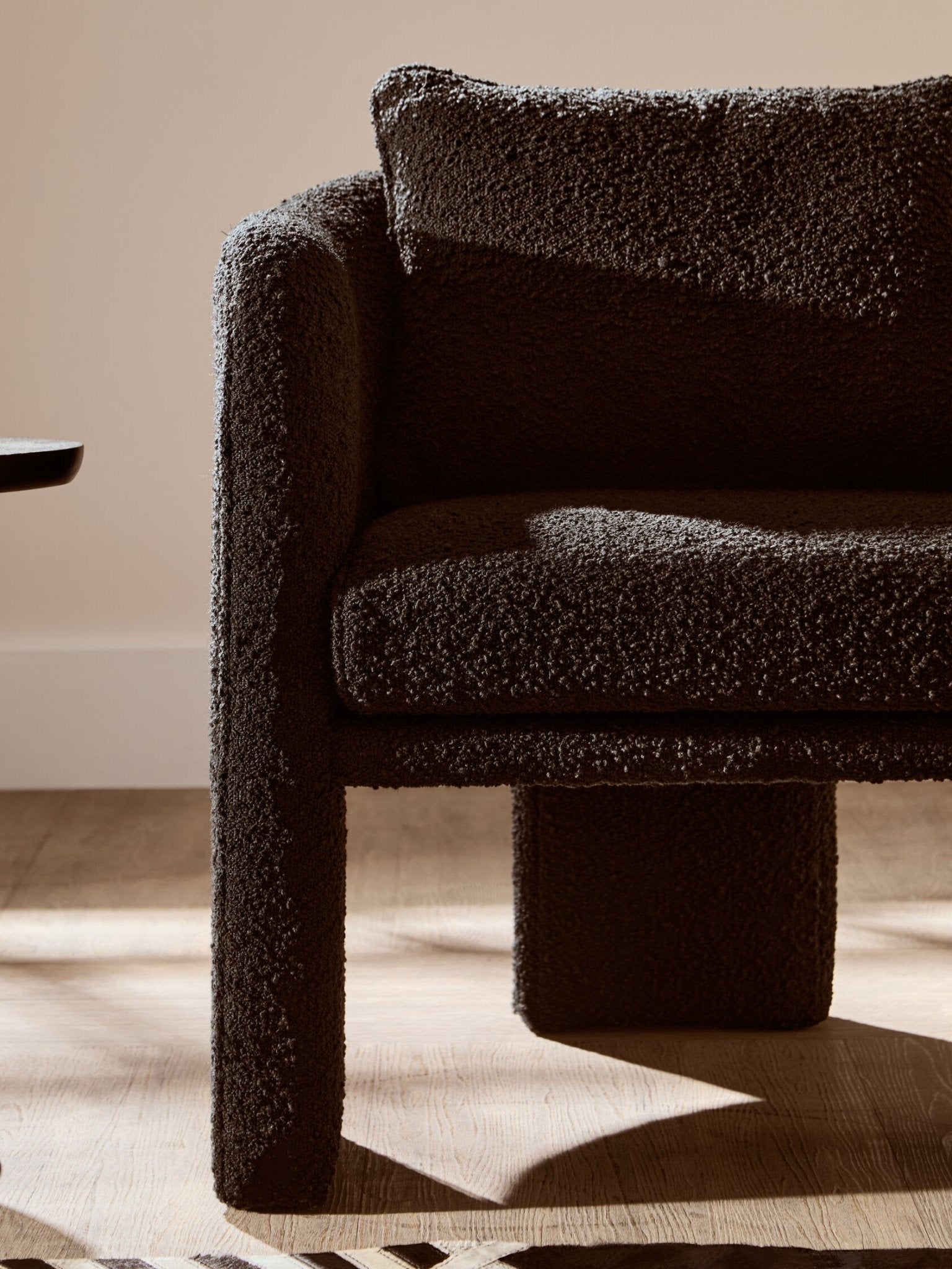 Ozzero Black Boucle Curved Armchair | Luxury Home Accessories | Heulog Glow