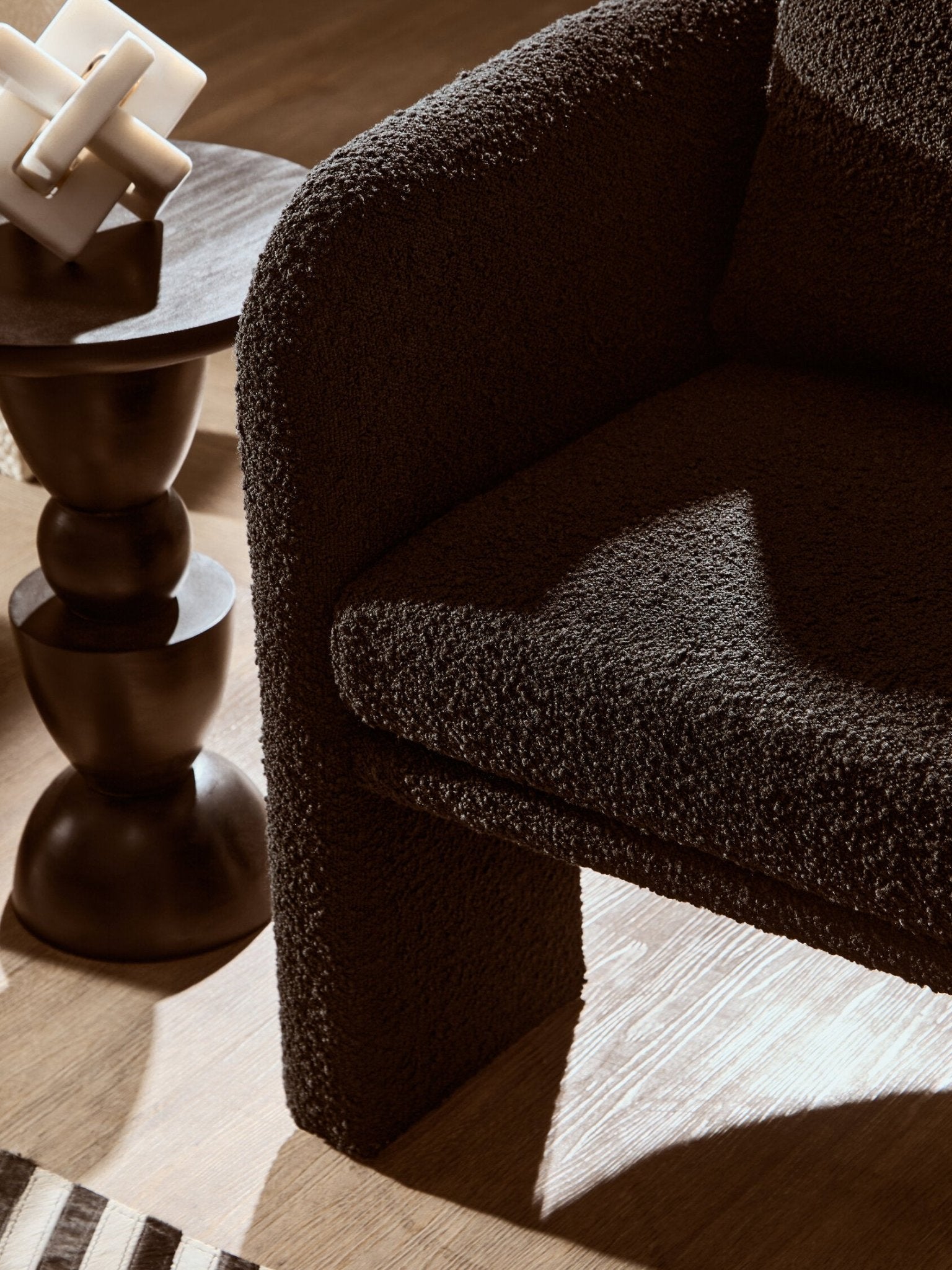 Ozzero Black Boucle Curved Armchair | Luxury Home Accessories | Heulog Glow