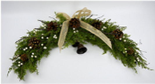 Arc Swag with White Berries, Pinecones with Bells and Bow Detail